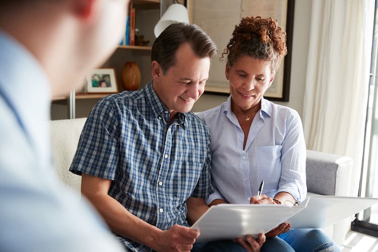 Senior Couple Meeting With Male Financial Advisor