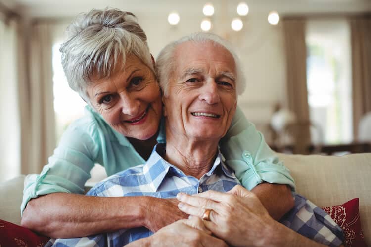 Senior couple relaxing in their home at a CCRC.