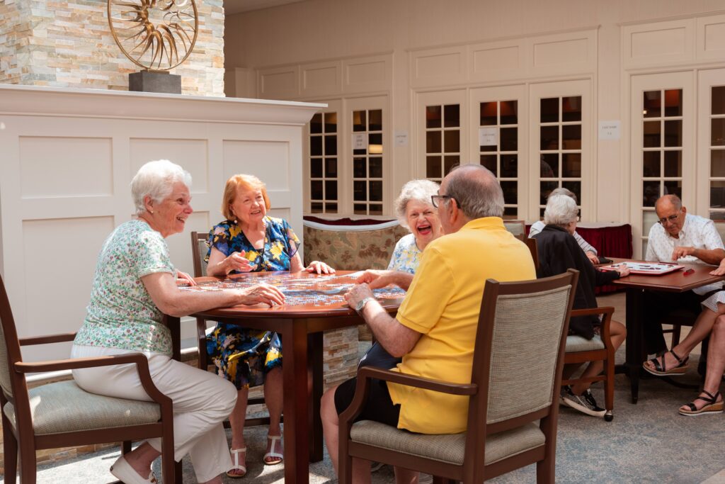 seniors laughing at table